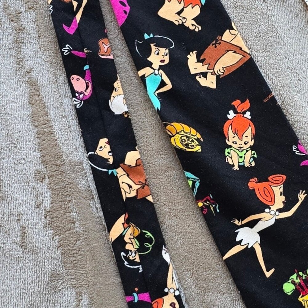 Flinstone theme tie. Have a yaba-doo time. Great conversation piece